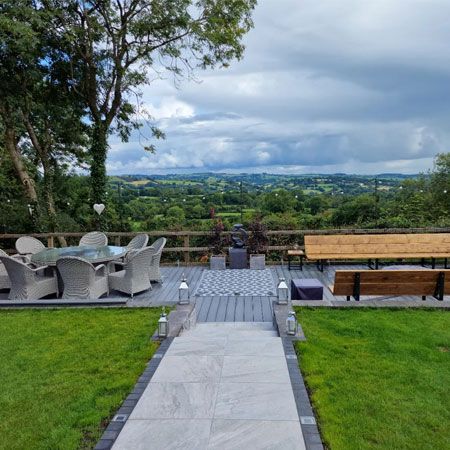 Porcelain patio and decked seating area overlooking the Derbyshire hills