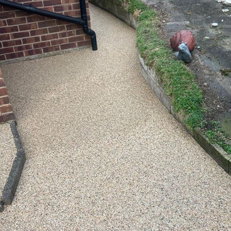 Resin-bound pathway laid around the side of a house